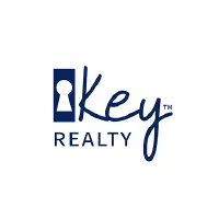 Company logo for key realty featuring a stylized keyhole and script font.